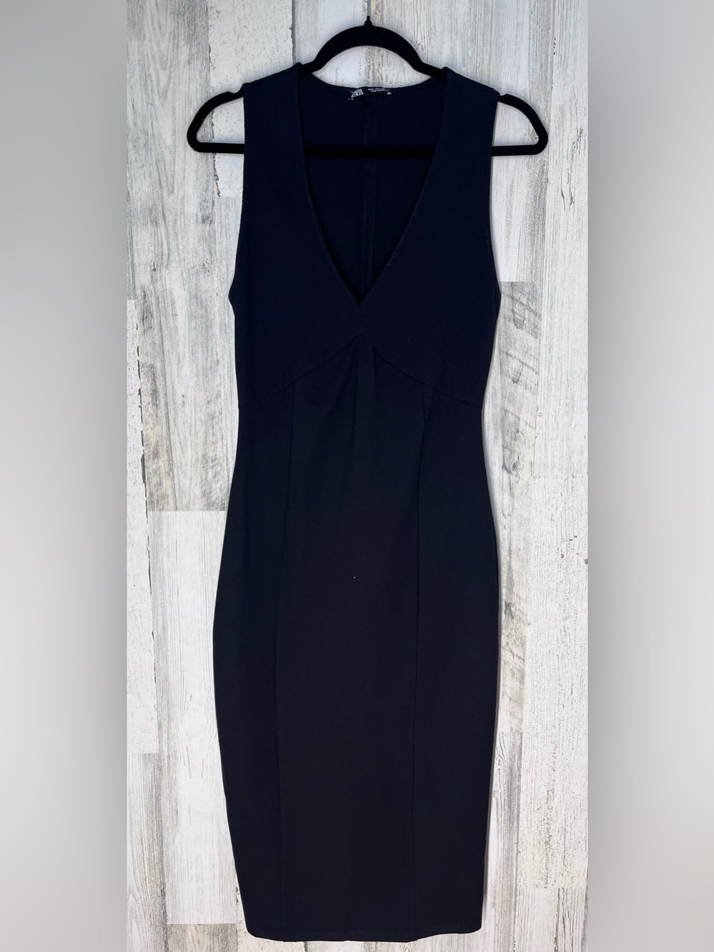 Zara black sleeveless sheath dress with a deep V-neckline & fitted silhouette sm
